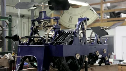 Large Mechanical Turret Clock Movement in a Workshop Stock Footage 345755440
