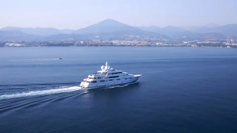 Large mega yacht cruising on the crowded coast of Andalusia Stock Footage 167553299