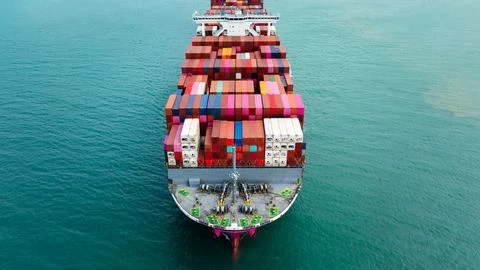 Large Merchant Container Ship Navigating Blue Ocean For International Trade.. Photos