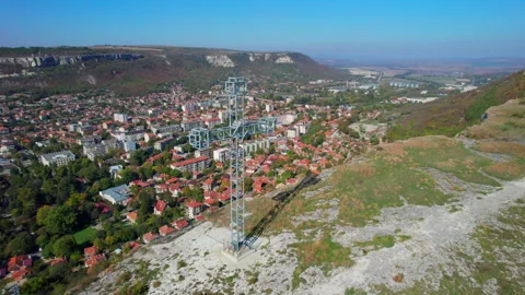 Large metal cross overlooking Provadia, Bulgaria Stock Footage 313293606