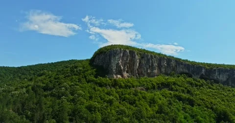 Large Metal Cross On Sharp Cliff Overlooking A Green Valley Central Bulgaria Stock Footage 300444408