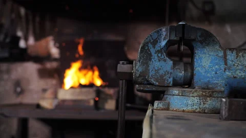 Large metal plates in a blacksmith's workshop against the background of a forge. Stock Footage 204910629