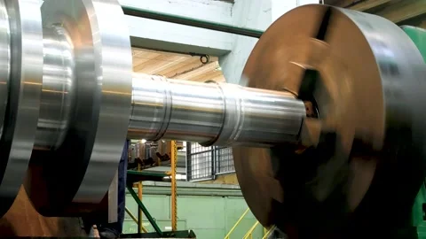 Large metal rotating part on a machine in a steel mill Stock Footage 212007236