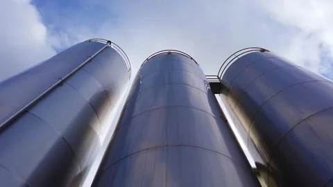 Large metal silo for storing raw material. Modern industrial plant. Stock Footage 149139477