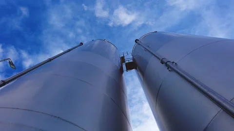 Large metal silo for storing raw material. Modern industrial plant. Stock Footage 149139554