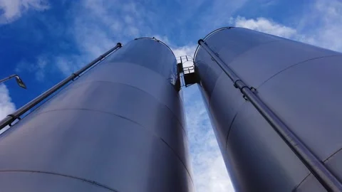 Large metal silo for storing raw material. Modern industrial plant. Stock Footage 149139600