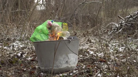Large metal tank in which plastic waste burns and poisons the environment Stock Footage 147457046