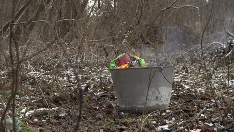 Large metal tank in which plastic waste burns and poisons the environment Stock Footage 147457830