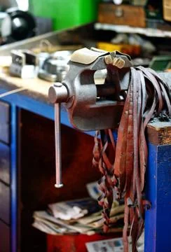 Large metal vice mounted on a work table Stock Photos