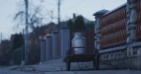 Large milk can in front of the house Stock Footage 89952448