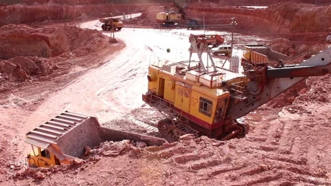 A large mining excavator loads a mining truck with bauxite. Stock Footage 122215128