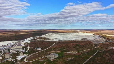 Large mining site in a remote area showing various structures and machinery used Stock Footage 345458638