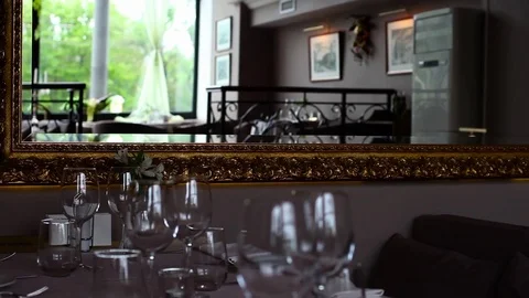 A large mirror at a table in the restaurant Stock Footage 72334928