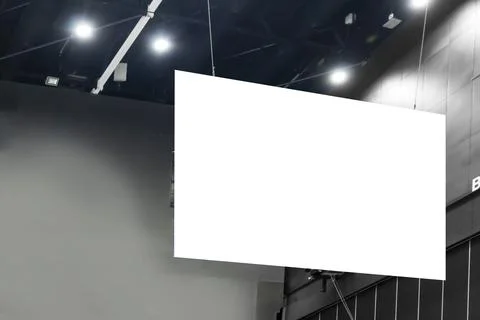 Large mockup of a sign hanging from the ceiling of the hall for displaying .. Stock Photos