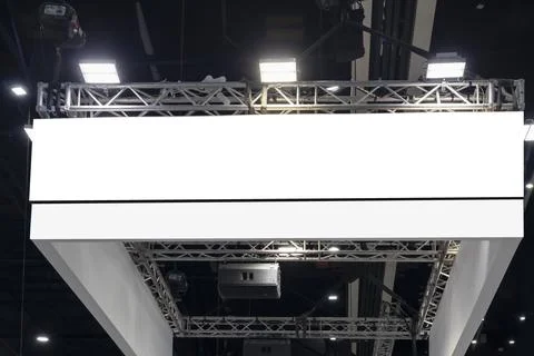 Large mockup of a sign hanging from the ceiling of the hall for displaying .. Stock Photos