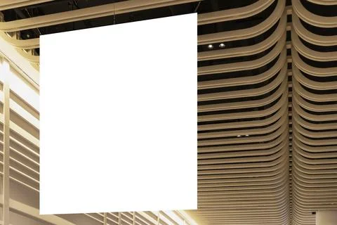Large mockup of a sign hanging from the ceiling of the hall for displaying .. Stock Photos