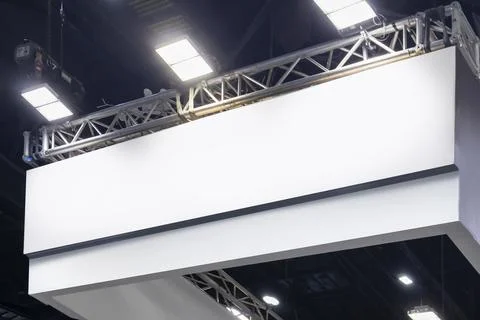 Large mockup of a sign hanging from the ceiling of the hall for displaying .. Stock Photos