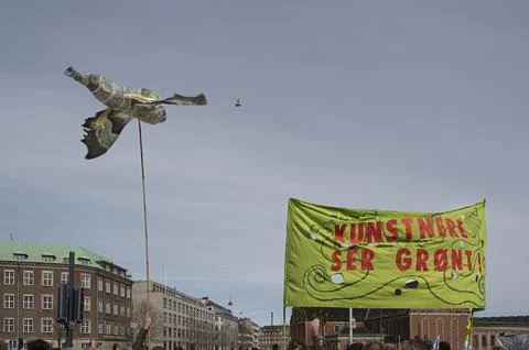 A large model of a bee against the sky at Extinction Rebellions demonstrati.. Stock Photos