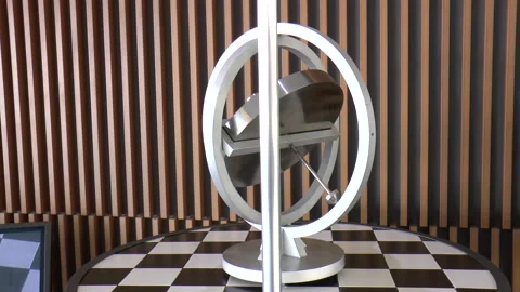 Large Model of a Spinning Gyroscope Wheel on Display Stock Footage 237933530