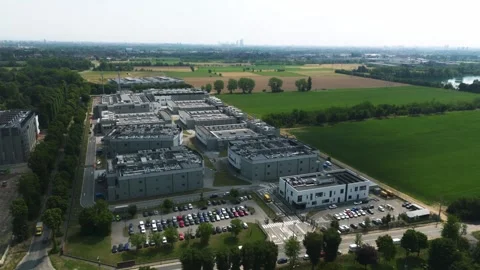 Large modern data center campus with multiple buildings and cooling systems on Stock Footage 336631391