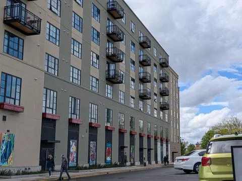 Large modern Eugene building decorated with diverse colorful artwork Stock Photos