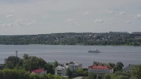 A large motorboat sails along the river Stock Footage 329248430