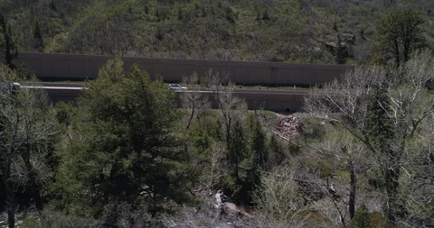 Large mountain highway next to Roaring Fork River near Basalt Colorado Stock Footage 92439491