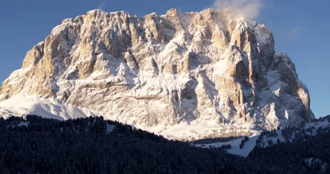 Large Mountain hit by Sunlight in the Alps, Aerial Landscape of Forest Stock Footage 150115226