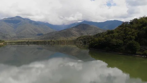 Large mountain lake. Mountains beyond the lake. Aerial view of Kvareli Lake in Stock Footage 116834878