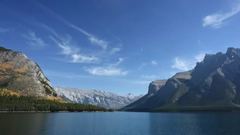 Large mountain lake with small waves surrounded by large mountains  Stock Footage 219225112