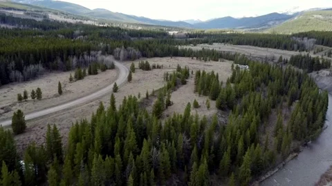Large mountain range with trees in the foreground Stock Footage 277266521