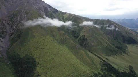 Large mountains covered with green grass and rocks Video stock 296283248