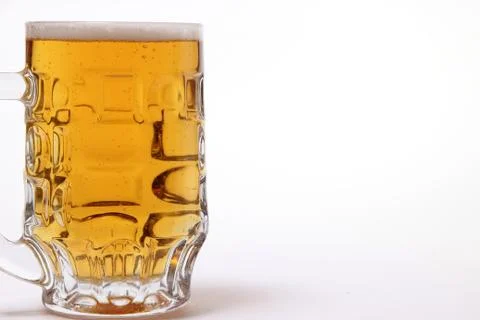 Large mug of light beer on a white background Stock Photos