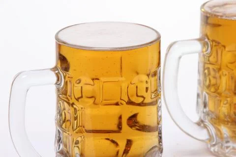 Large mug of light beer on a white background Stock Photos