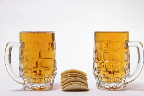 Large mug of light beer on a white background Stock Photos