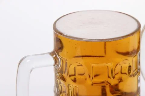 Large mug of light beer on a white background Stock Photos