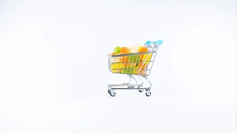 Large, multi-colored candy in a shopping trolley. Jelly candies in a shopping Stock Footage 100757541