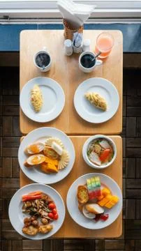 Large multi-course breakfast for two and drinks. Top view. Stock Photos