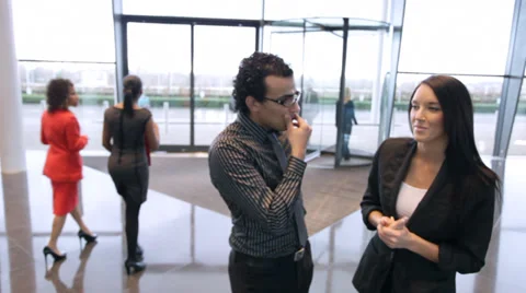 Large multi ethnic business group in relaxed meeting area of a large Stock Footage 32718178