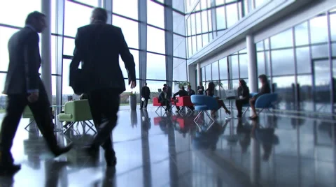 Large multi ethnic business group in relaxed meeting area of a large Stock Footage 32718669