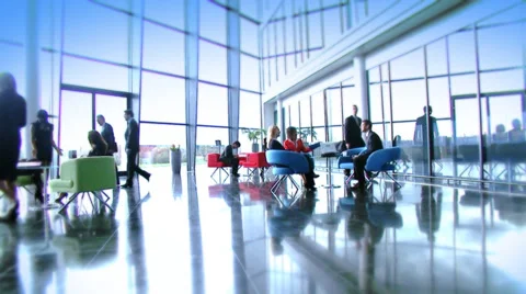 Large multi ethnic business group in relaxed meeting area of a large Stock Footage 32718673