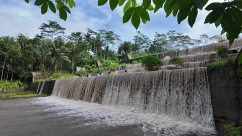 Large multi-level dam on a river, Grojogan Watu Purbo, Yogyakarta Vídeos de archivo 291658615
