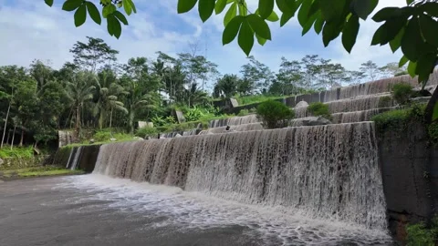 Large multi-level dam on a river, Grojogan Watu Purbo, Yogyakarta Vídeos de archivo 291658924