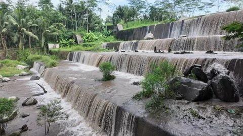 Large multi-level dam on a river, Grojogan Watu Purbo, Yogyakarta Vídeos de archivo 291660553