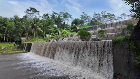 Large multi-level dam on a river, Grojogan Watu Purbo, Yogyakarta Vídeos de archivo 291660859