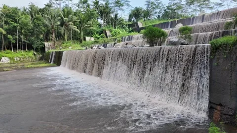 Large multi-level dam on a river, Grojogan Watu Purbo, Yogyakarta Vídeos de archivo 291662228