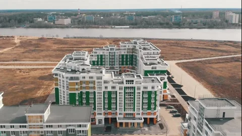 Large multi-storey community building with parking lots Stock Footage 132895967