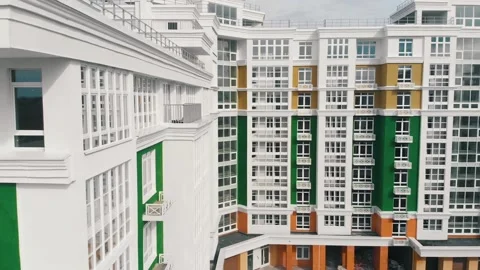 Large multi-storey community building with parking lots Stock Footage 137592054