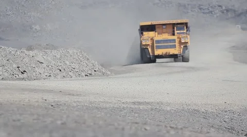 A large multi-ton dump truck with coal in the distance Stock Footage 45807890