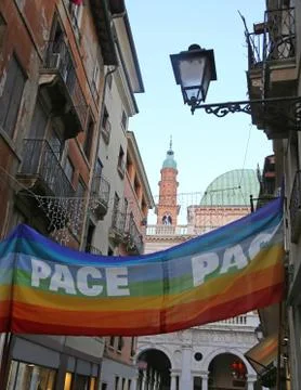 Large multicolored flags in the narrow Via della Citta di Vicenza with the te 写真素材